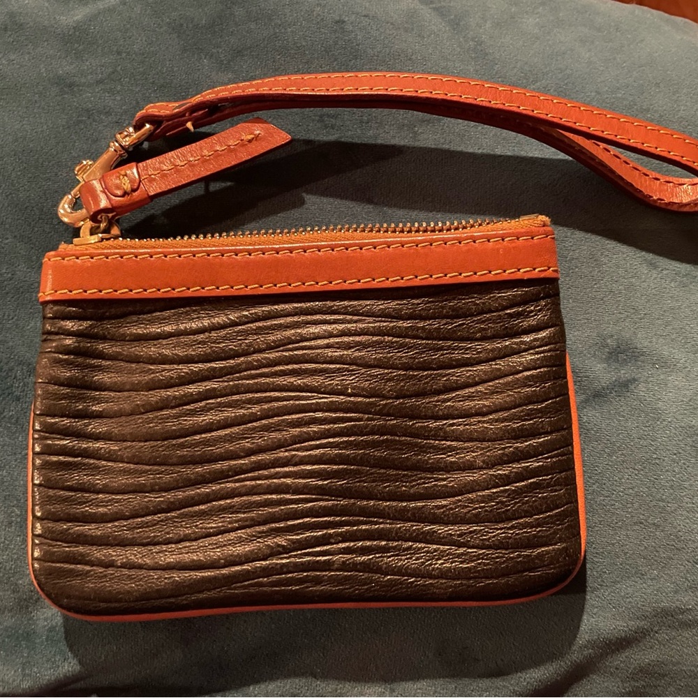 Dooney & Bourke Black and Tan Textured Wristlet with Red Interior - Picture 2 of 3